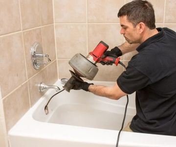 When Should You Call a Plumber for Unclogging a Bathtub Drain