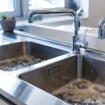 Why Is My Kitchen Sink Filling with Water When Washing Machine Drains?