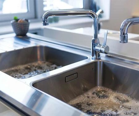 Why Is My Kitchen Sink Filling with Water When Washing Machine Drains?