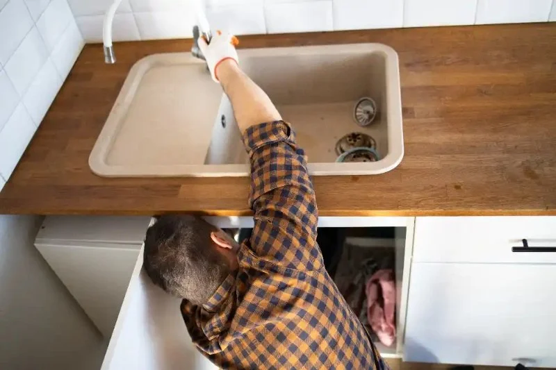 Why Your Kitchen Sink Is Backing Up Into the Dishwasher and How to Fix It