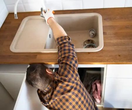 Why Your Kitchen Sink Is Backing Up Into the Dishwasher and How to Fix It