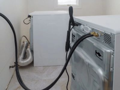 Why Is My Washing Machine Drain Backing Up? Causes and Fixes
