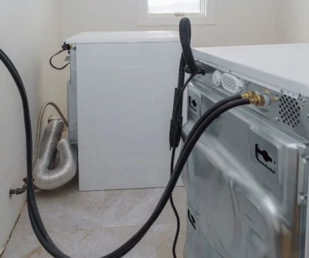 Why Is My Washing Machine Drain Backing Up? Causes and Fixes